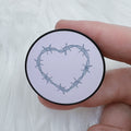 Enchufe con forma de corazón de púas | Soporte para teléfono