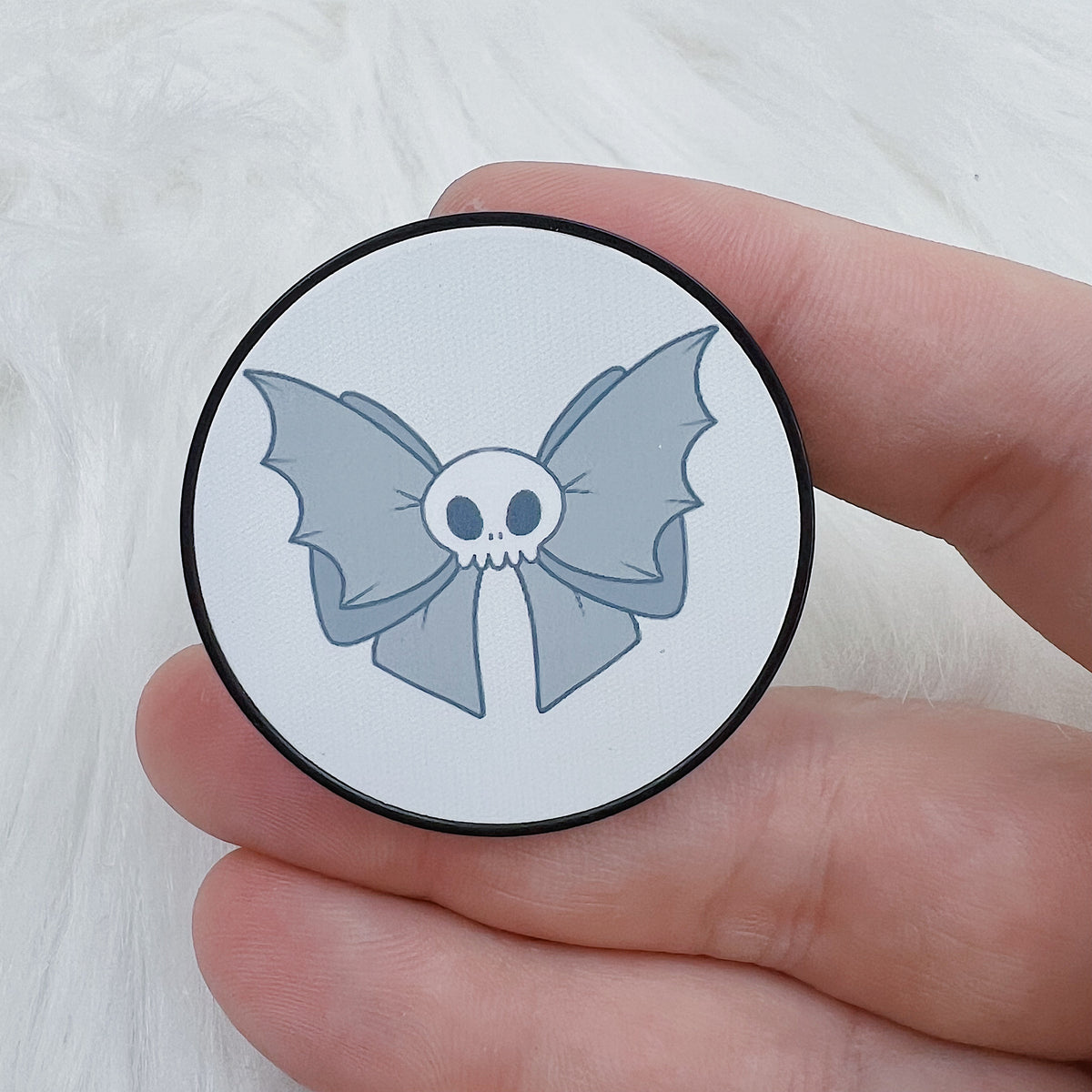 Enchufe Pop con lazo de murciélago Skele | Soporte para teléfono
