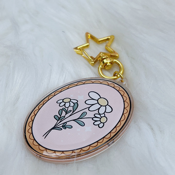 Llavero acrílico floral esqueleto