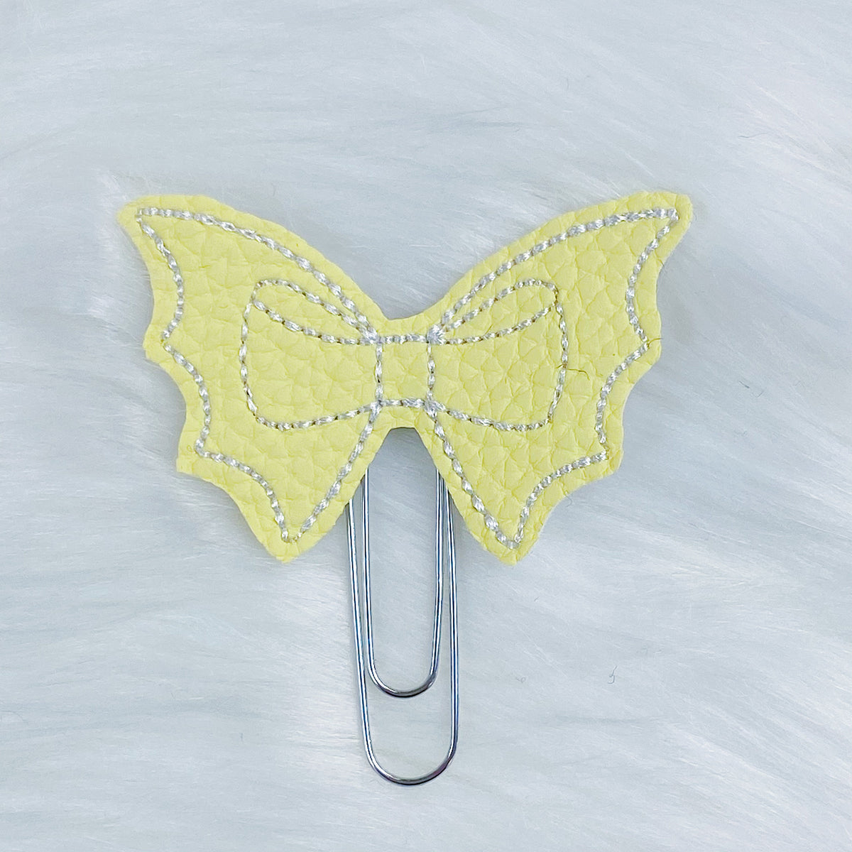 Clip de planificador Feltie de arco de murciélago amarillo + blanco